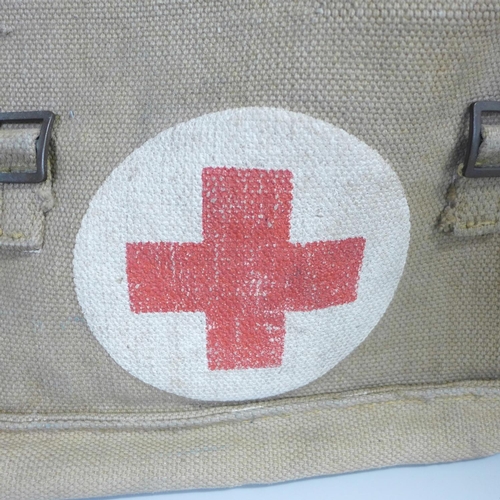 728 - A helmet, kit bag and a Red Cross canvas bag