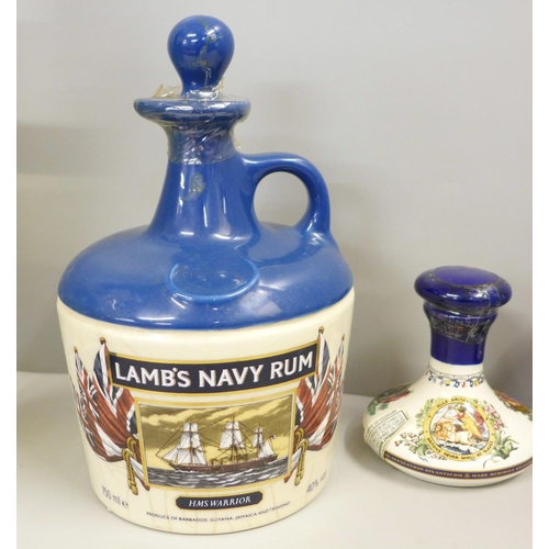 781 - Lamb's Navy Pusser's Rum, three bottles, one boxed and a doctor and nurse novelty salt and pepper po... 