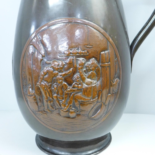 785 - A circa 1900 large copper jug with coat of arms and tavern scene, 47cm