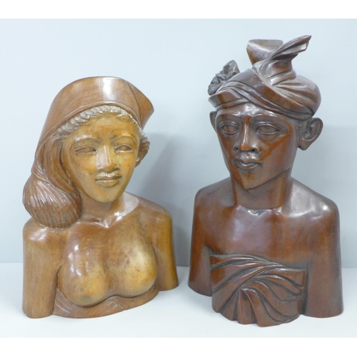 788 - Two wooden carved figures of a Bali man and woman