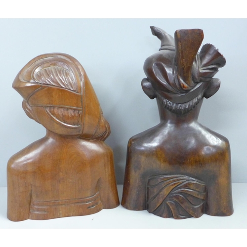 788 - Two wooden carved figures of a Bali man and woman