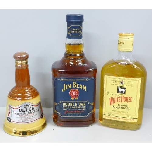 797 - Three bottles; Jim Beam Double Oak Twice Barrelled Bourbon whisky, a half bottle of White Horse whis... 