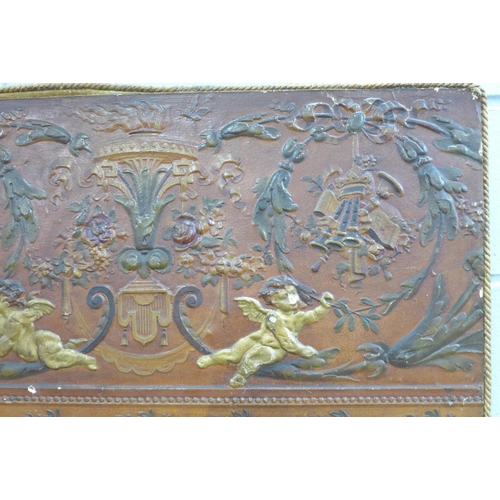 806 - A leather panel of cherubs, 85cm x 45cm