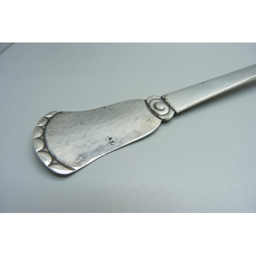 821 - A large Arts and Crafts Danish silver basting spoon, Christian F. Heise, 1904-1932, 147g, 36cm