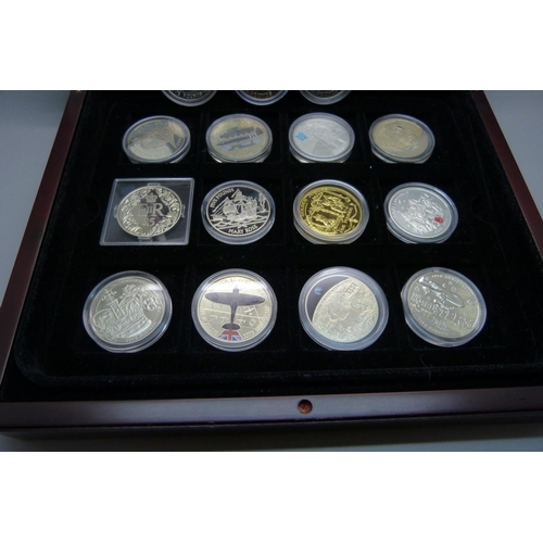 830 - Nineteen commemorative £5 coins, in a box