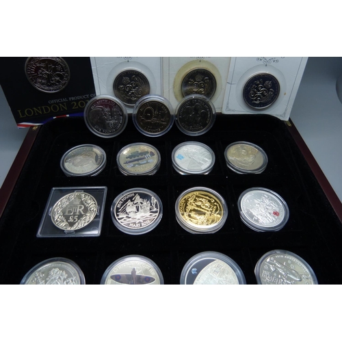 830 - Nineteen commemorative £5 coins, in a box