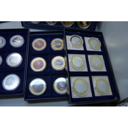 831 - A collection of gold and silver plated commemorative coins, 48 in total