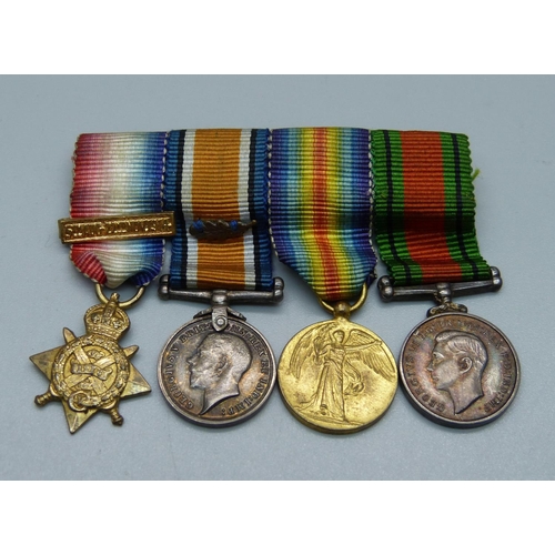 848 - A trio of WWI miniature medals and a miniature Defence medal