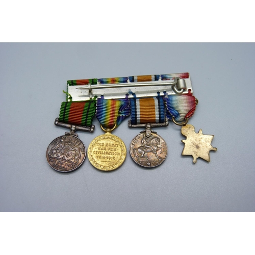 848 - A trio of WWI miniature medals and a miniature Defence medal