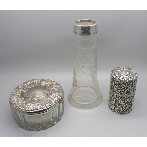 861 - A late Victorian silver container with hinged lid, a silver rimmed glass vase and a glass powder jar