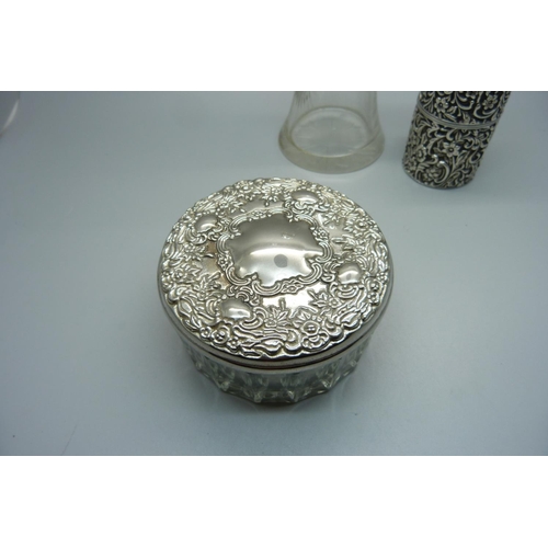 861 - A late Victorian silver container with hinged lid, a silver rimmed glass vase and a glass powder jar