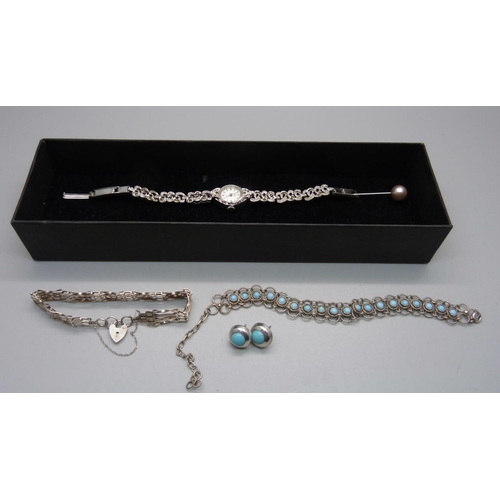 877 - A lady's marcasite cocktail watch, a silver gate bracelet, one other bracelet and a pair of earrings