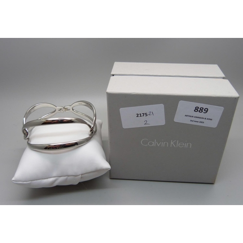 889 - A Calvin Klein silvertone segment link bracelet, boxed