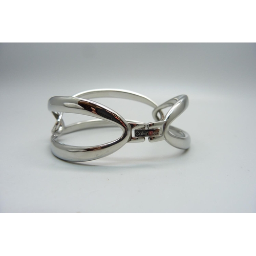 889 - A Calvin Klein silvertone segment link bracelet, boxed