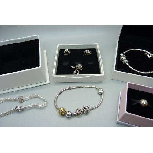 890 - A collection of five Pandora charms, two with 14ct gold inclusions, two Pandora bracelets with six c... 