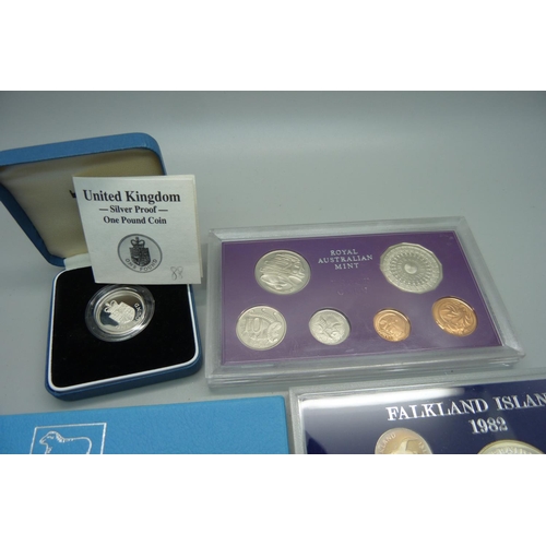 912 - A silver proof £1 coin, a 1977 Royal Australia mint proof coin set and a 1982 Falkland Islands Liber... 