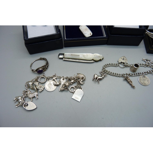 915 - Silver jewellery including a charm bracelet, mother of pearl and silver bladed fruit knife, etc.