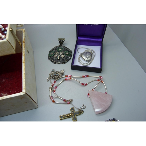 921 - A jewellery box with contents including silver, St. Justin, etc.