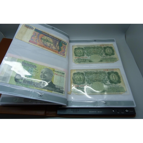 927 - An album of British and foreign bank notes, 10 shillings notes, US dollars, etc.