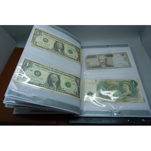 927 - An album of British and foreign bank notes, 10 shillings notes, US dollars, etc.