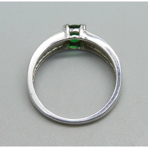 928 - A 9ct white gold and green stone ring, 3.2g, O