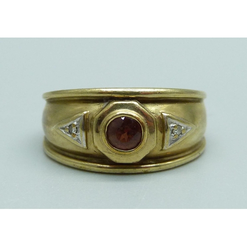 933 - A 9ct gold, red stone and diamond ring, 3.5g, L