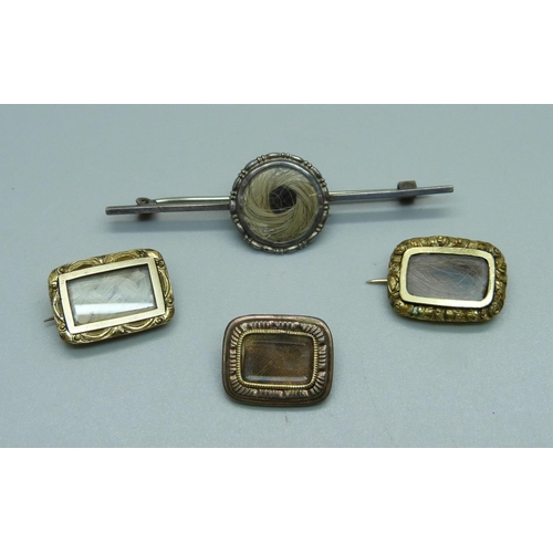 934 - Three small mourning brooches and a silver mourning brooch