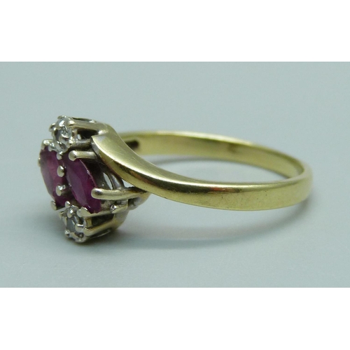 945 - A 14ct gold, red stone and diamond four stone ring, 2.7g, N