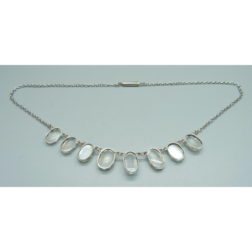 971 - An Arts and Crafts moonstone necklet, tests as silver, 43.5cm