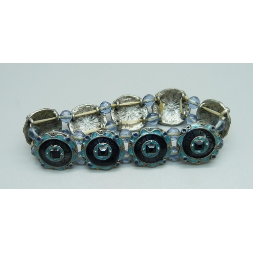 975 - An enamel and stone set bracelet