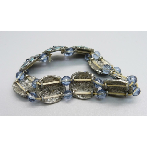 975 - An enamel and stone set bracelet