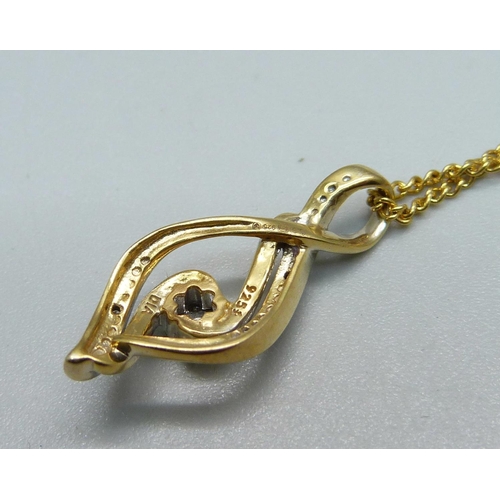 981 - A silver gilt and diamond pendant with chain