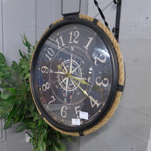 1311 - A black metal and rope industrial style clock depicting a compass