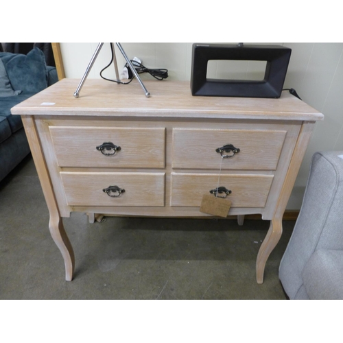 1393 - A light oak effect four drawer chest