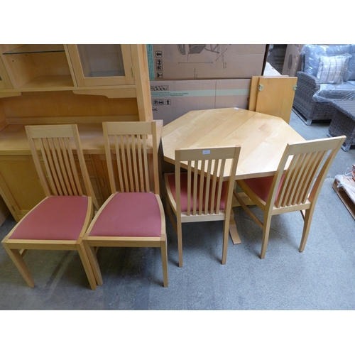 1581 - A birch octagonal extending dining table and four red upholstered birch dining chairs by Collis King... 