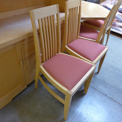 1581 - A birch octagonal extending dining table and four red upholstered birch dining chairs by Collis King... 