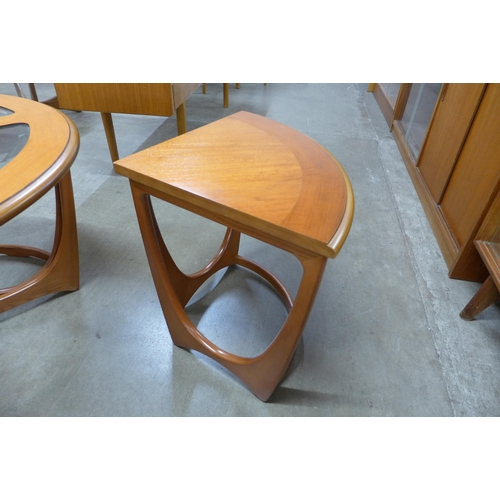 100 - A G-Plan teak and glass topped circular nest of tables