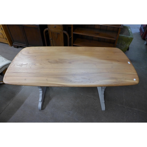 113 - A painted Ercol elm and beech refectory table