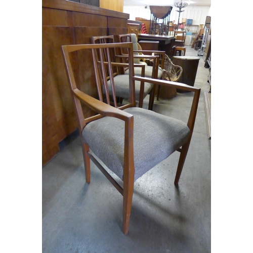 115 - A set of three teak chairs, small cane chair and a Lloyd Loom linen box