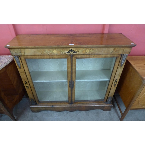 132 - A Victorian inlaid walnut two door side cabinet