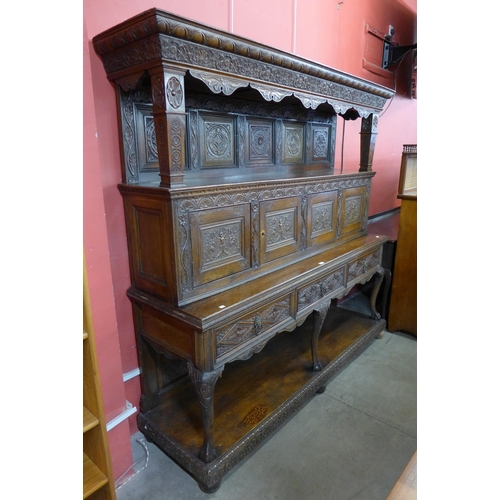 136 - An extensively carved oak Elizabethan Revival dresser