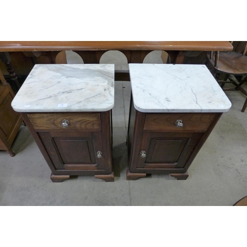 164 - A pair of French oak and white marble topped pot cupboards