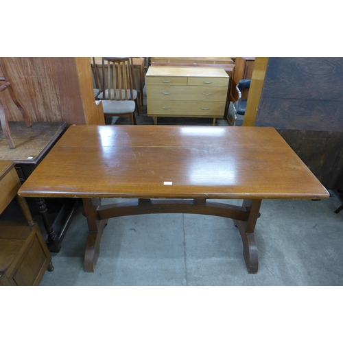 167 - An Arts and Crafts walnut and elm refectory table