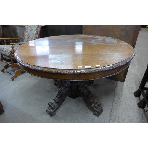 172 - A Victorian carved oak circular centre table