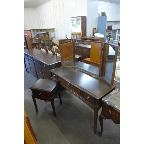 240 - Two Stag Minstrel mahogany sideboards, a dressing table and bedside table