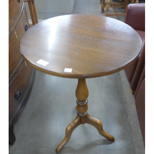 241 - An Ercol Golden Dawn elm tripod table