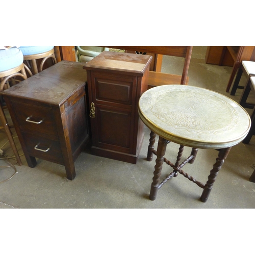 243 - A Victorian oak and burr elm pot cupboard and an eastern brass topped occasional table, on oak barle... 