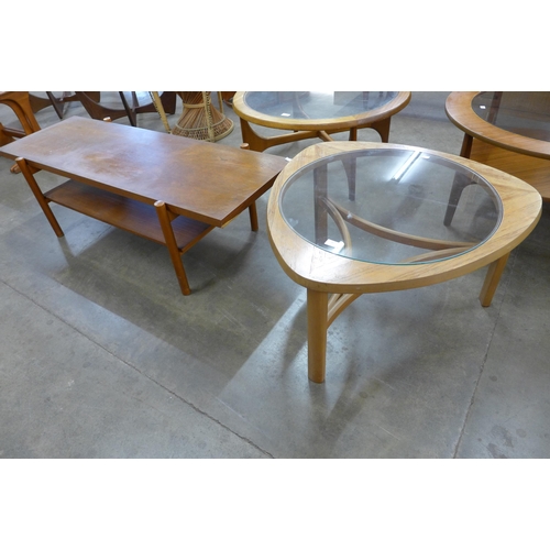 30 - A Nathan teak and glass topped triangular coffee table and a rectangular teak coffee table