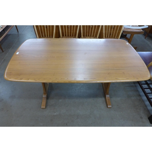 39 - An Ercol Blonde elm and beech refectory table