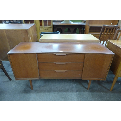 51 - An Austin Suite teak concave sideboard